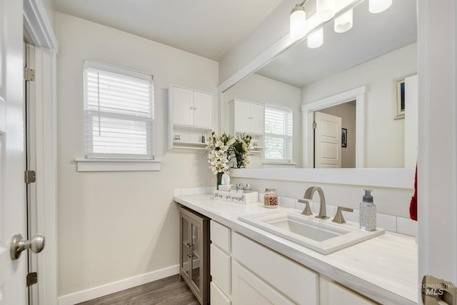 2982 W Mcintosh, Kuna, ID 83634 - bathroom with vanity, wood finished floors, and baseboards
