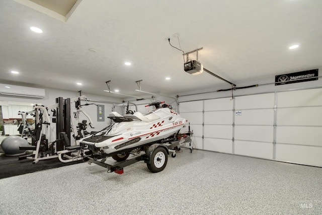 2982 W Mcintosh, Kuna, ID 83634 - garage with a garage door opener, an AC wall unit, and recessed lighting