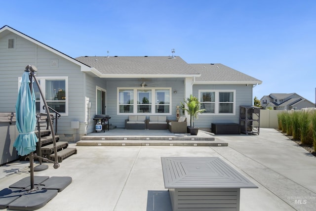 2982 W Mcintosh, Kuna, ID 83634 - rear view of property featuring an outdoor living space, a ceiling fan, a patio area, and a shingled roof