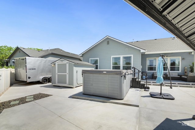 2982 W Mcintosh, Kuna, ID 83634 - back of house with a patio and a hot tub