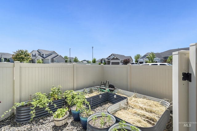 2982 W Mcintosh, Kuna, ID 83634 - view of patio / terrace with a garden and a residential view