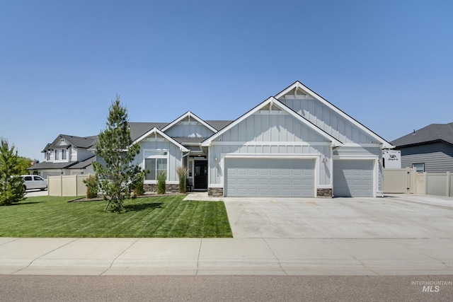2982 W Mcintosh, Kuna, ID 83634 - craftsman inspired home featuring board and batten siding, an attached garage, driveway, and stone siding