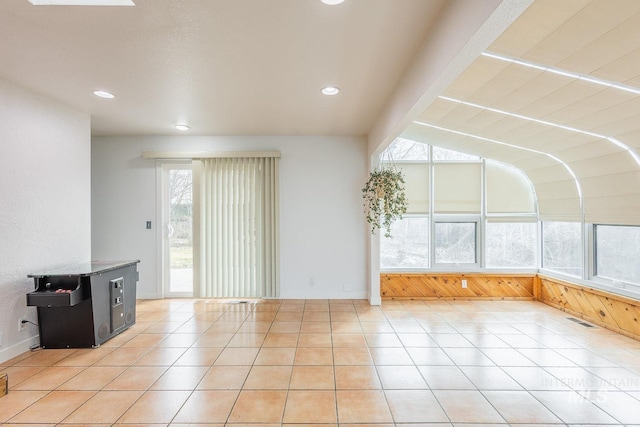 unfurnished room with recessed lighting, visible vents, and light tile patterned flooring