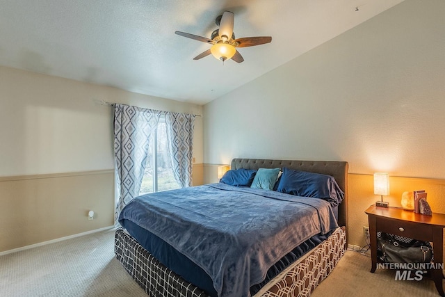 bedroom with carpet, vaulted ceiling, baseboards, and ceiling fan