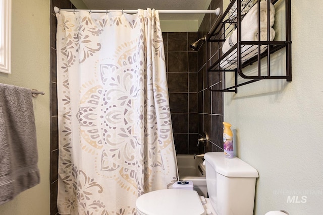 full bathroom featuring toilet and shower / tub combo with curtain