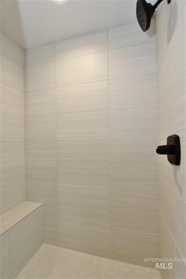 bathroom with a tile shower