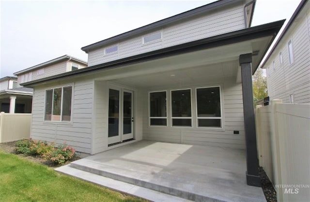 rear view of property featuring a patio