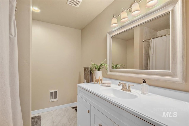 8618 Latimore Ln, Middleton, ID 83644 - full bathroom featuring marble finish floors, vanity, and baseboards