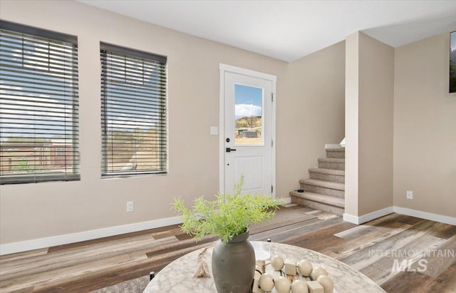 8618 Latimore Ln, Middleton, ID 83644 - entryway featuring wood finished floors, baseboards, and stairway