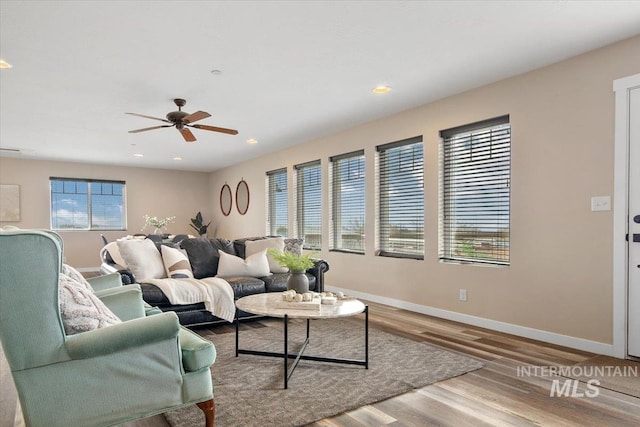 8618 Latimore Ln, Middleton, ID 83644 - living area with baseboards, wood finished floors, a ceiling fan, and recessed lighting