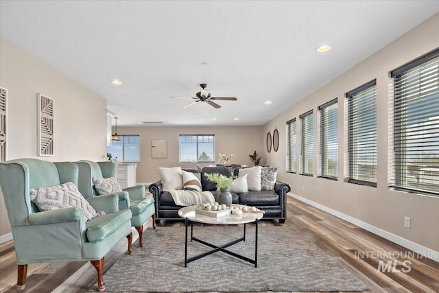 8618 Latimore Ln, Middleton, ID 83644 - living area with wood finished floors, ceiling fan, baseboards, and recessed lighting