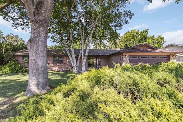 1719 S Gekeler Ln, Boise, ID 83706 - view of front of property with a front lawn, a garage, and brick siding