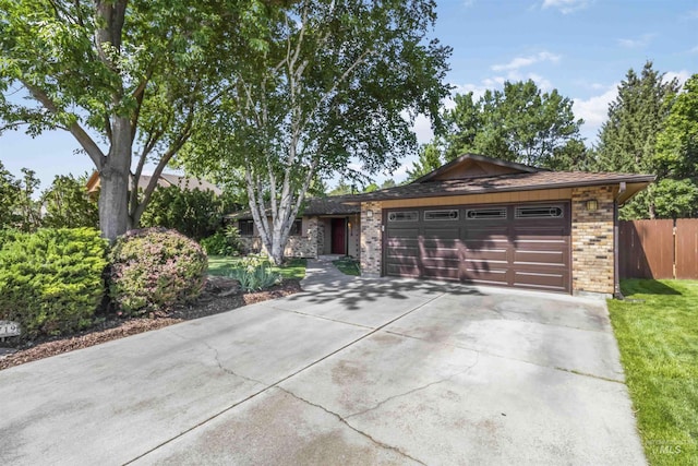 1719 S Gekeler Ln, Boise, ID 83706 - ranch-style house featuring driveway, a garage, and brick siding