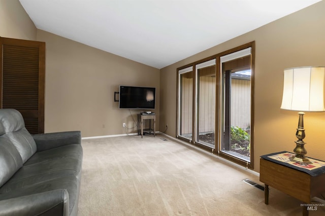 1719 S Gekeler Ln, Boise, ID 83706 - carpeted living room featuring lofted ceiling, baseboards, and healthy amount of natural light