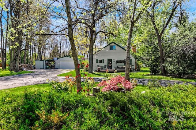 10838 W Southerland St, Boise, ID 83709 - view of front of property with an outbuilding, a front yard, and a garage