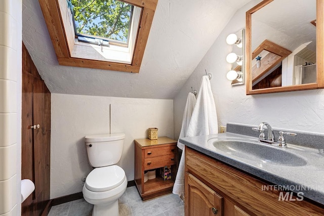 10838 W Southerland St, Boise, ID 83709 - bathroom with toilet, a textured wall, lofted ceiling with skylight, and vanity