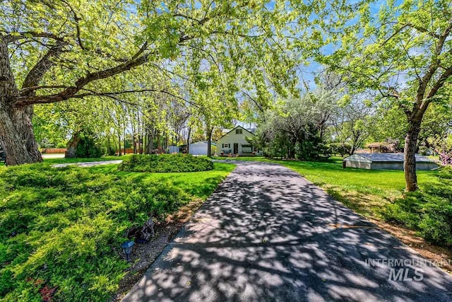 10838 W Southerland St, Boise, ID 83709 - surrounding community featuring aphalt driveway and a yard