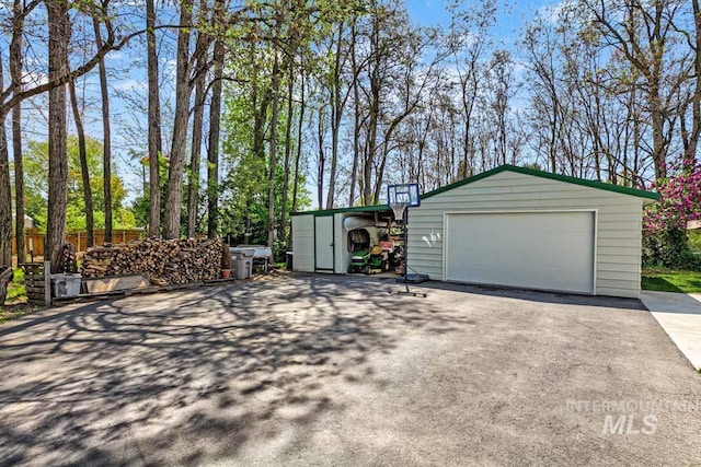 10838 W Southerland St, Boise, ID 83709 - garage featuring a garage and fence