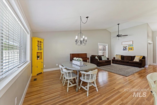1879 Prairie View Way, Middleton, ID 83644 - dining room featuring lofted ceiling, plenty of natural light, light wood-type flooring, and baseboards