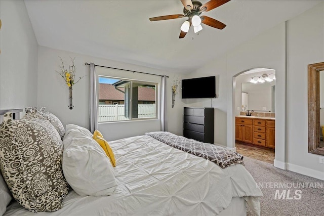 1879 Prairie View Way, Middleton, ID 83644 - bedroom with lofted ceiling, arched walkways, light colored carpet, ensuite bath, and a ceiling fan