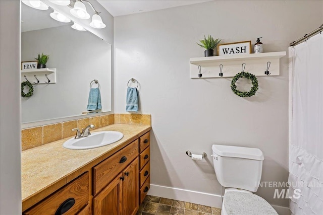 1879 Prairie View Way, Middleton, ID 83644 - bathroom featuring baseboards, vanity, toilet, and backsplash