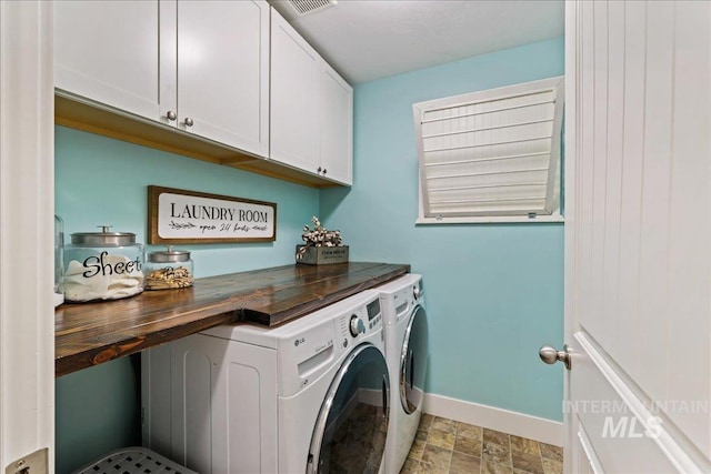 1879 Prairie View Way, Middleton, ID 83644 - laundry area with washer and dryer, cabinet space, baseboards, and light stone finish floors