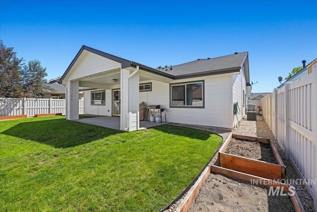1879 Prairie View Way, Middleton, ID 83644 - rear view of property featuring a vegetable garden and a patio