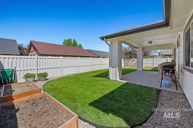 1879 Prairie View Way, Middleton, ID 83644 - view of yard featuring a vegetable garden and a patio area