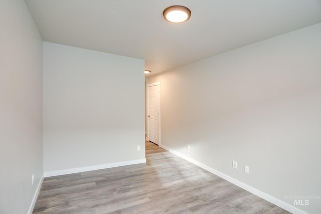 spare room with light hardwood / wood-style floors