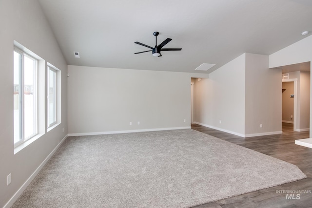 spare room with hardwood / wood-style floors, ceiling fan, plenty of natural light, and vaulted ceiling