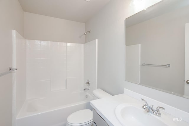 full bathroom with vanity, toilet, and  shower combination