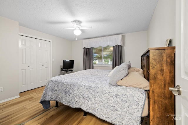 2800 Taylor Ct, Nampa, ID 83686 - bedroom with light wood finished floors, a closet, a textured ceiling, and a ceiling fan