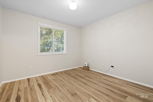 2800 Taylor Ct, Nampa, ID 83686 - unfurnished room with wood finished floors and a textured ceiling