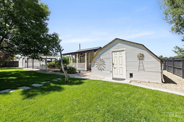2800 Taylor Ct, Nampa, ID 83686 - back of property featuring a porch and an outdoor structure