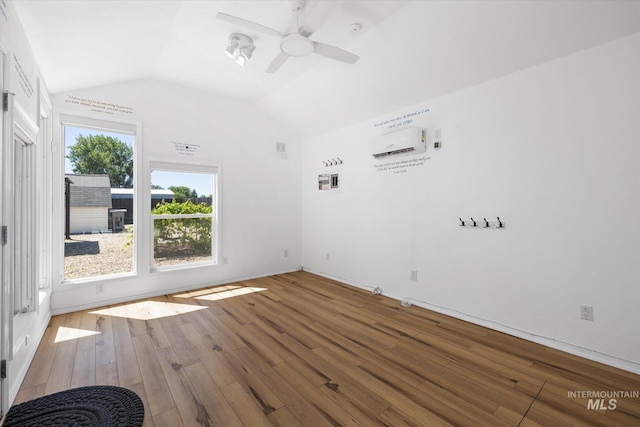 2800 Taylor Ct, Nampa, ID 83686 - spare room featuring a wall mounted air conditioner, lofted ceiling, wood finished floors, and ceiling fan