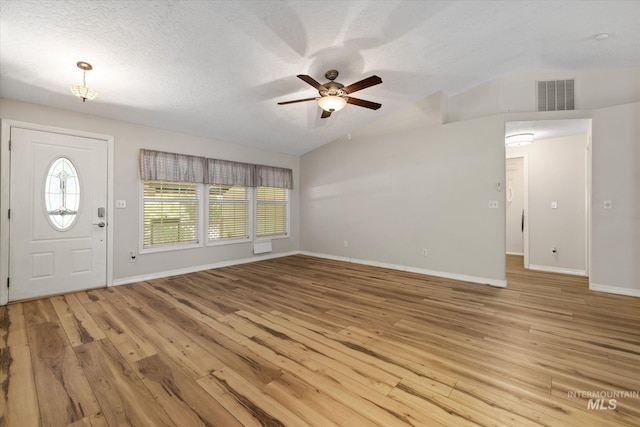 2800 Taylor Ct, Nampa, ID 83686 - foyer featuring a ceiling fan, lofted ceiling, light wood-type flooring, and a textured ceiling