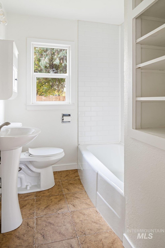 bathroom featuring tile patterned floors and toilet