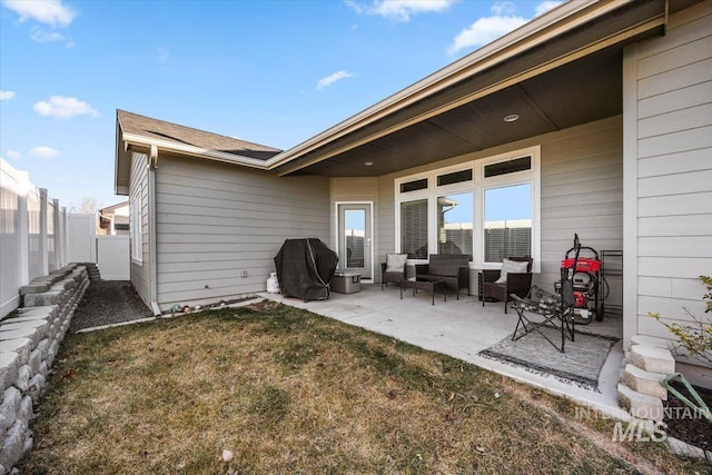 back of property featuring a yard and a patio