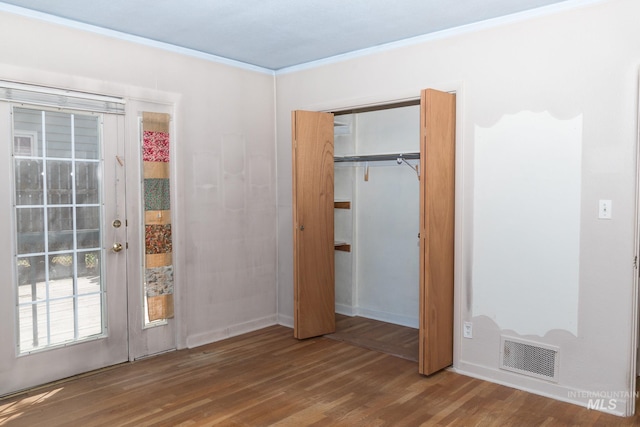 286 SW 3rd Ave, Ontario, OR 97914 - unfurnished bedroom with wood finished floors, french doors, crown molding, a closet, and baseboards