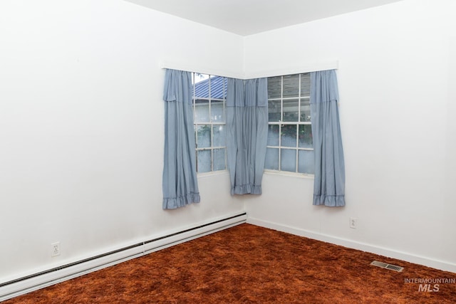 286 SW 3rd Ave, Ontario, OR 97914 - spare room featuring a baseboard heating unit, carpet, and baseboards