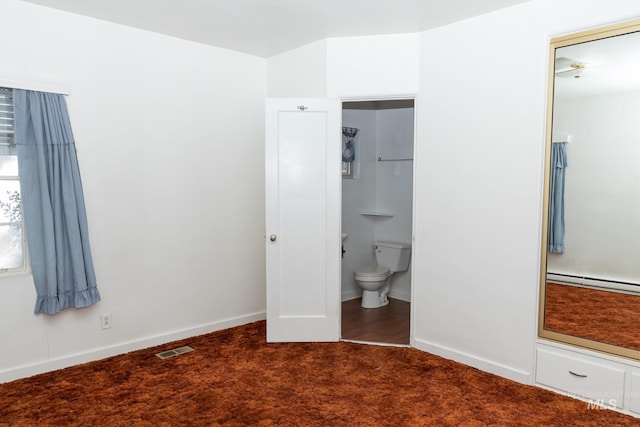 286 SW 3rd Ave, Ontario, OR 97914 - unfurnished bedroom featuring a baseboard radiator, carpet flooring, ensuite bathroom, and baseboards