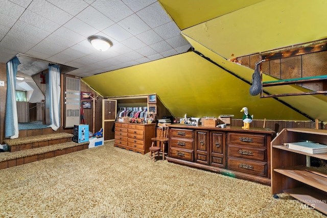 bonus room with lofted ceiling and carpet floors