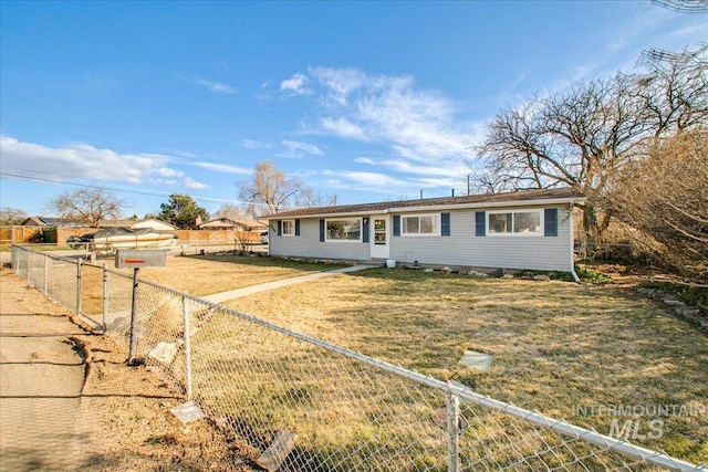 ranch-style home with a front lawn and fence private yard