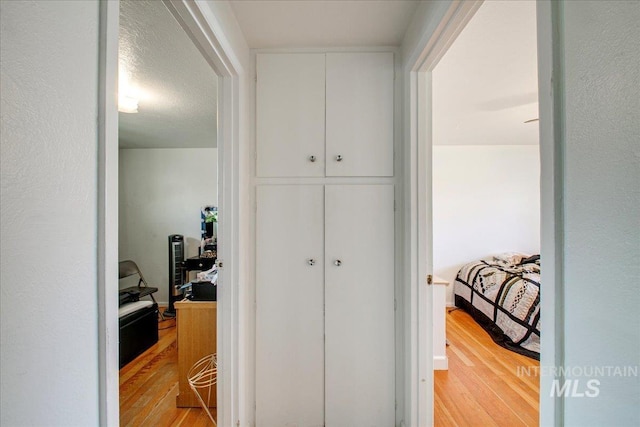 hall with light wood-type flooring