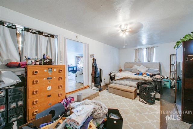 bedroom featuring ceiling fan and access to exterior