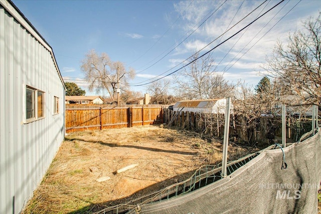 view of yard with a fenced backyard