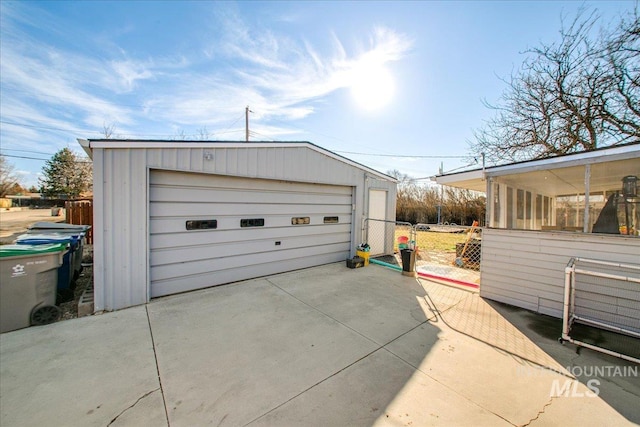 detached garage with fence