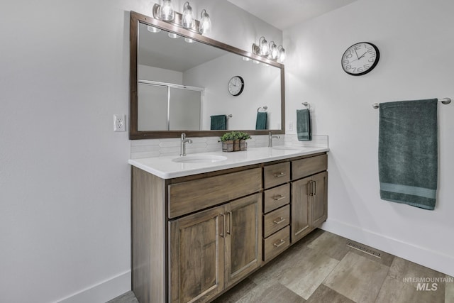 bathroom with vanity and walk in shower