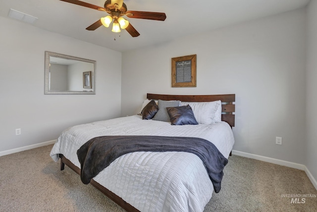 bedroom with ceiling fan and light carpet