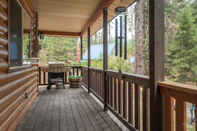 wooden terrace featuring grilling area